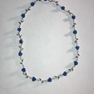 Z171-Costume jewelry-Silver colored necklace blue roses + leaves w blue stones.